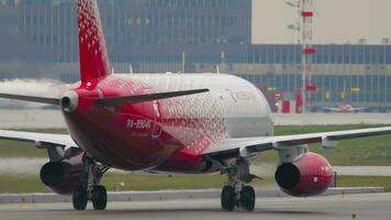 MOSCOW, RUSSIAN FEDERATION JULY 30, 2021 - Sukhoi Superjet 100 95B, RA 89046 of Rossiya taxiing, back view. Close shot, plane on the runway at the airport video