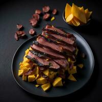 delicious meat dish with bacon and yellow cheese, accompanied with potato chips on the table photo