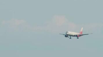 SOCHI, RUSSIA AUGUST 02, 2022 - Airbus A320 of Rossiya descending before landing at Sochi airport, side view. Tourism and travel concept video