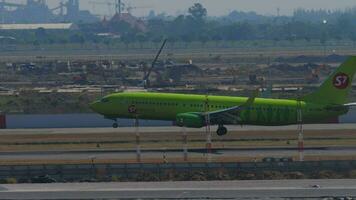 BANGKOK, THAILAND JANUARY 19, 2023 - Commercial aircraft Boeing 737 of S7 Airlines landing at Suvarnabhumi airport, Bangkok. Passenger flight, approach, descent. Tourism and travel concept video