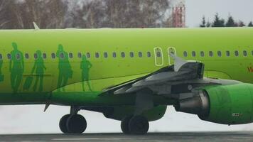 NOVOSIBIRSK, RUSSIA JANUARY 22, 2017 - Jet airliner S7 Airlines taxis in winter at Tolmachevo airport, Novosibirsk OVB. Airplane on the airfield, snowy winter video