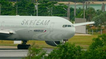 PHUKET, THAILAND DECEMBER 03, 2016 - Aeroflot Boeing 777 VQ BQG in SkyTeam livery taxiing before departure Phuket airport. video