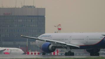 MOSCOW, RUSSIAN FEDERATION JULY 28, 2021 - Passenger plane Boeing 777 of Aeroflot on the runway before takeoff at Sheremetyevo Airport. Tourism and travel concept video