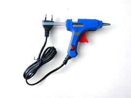 Blue thermoelectric glue gun mini guns on a white background photo