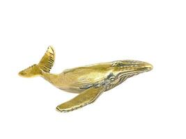 Whale gold colored animal statue on white background photo