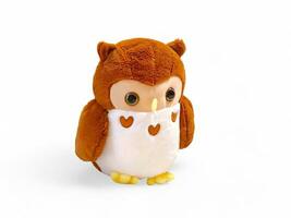 Owl on white and brown, stuffed animal isolated on white photo