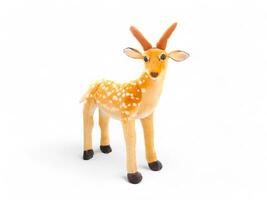 Deer doll with white spots isolated on white photo