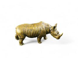 rhino gold color animal statue on white background photo