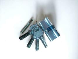 The lock and cylinder are silver on a white background photo