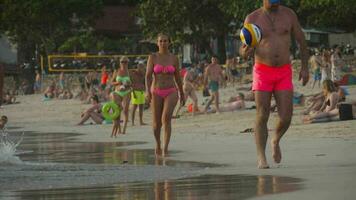 PHUKET, THAILAND JANUARY 19, 2023 - People relax on the sandy beach of Phuket. Crowded beach video