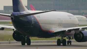 MOSCOW, RUSSIAN FEDERATION JULY 28, 2021 - Middle shot, Boeing 737 of Aeroflot Russian Airlines taxiing on the runway at Sheremetyevo airport SVO. Tourism and travel concept video