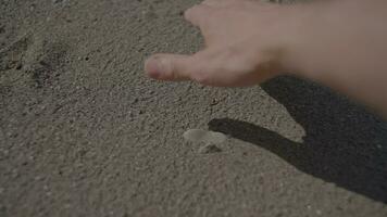 Person Touching Sand Stones with Hand Outdoors in Nature video