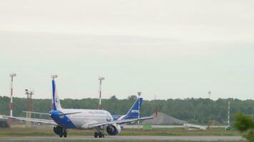 NOVOSIBIRSK, RUSSIAN FEDERATION JULY 15, 2022 - Airbus A321 of Ural Airlines speed up before takeoff at Tolmachevo Airport, Novosibirsk. Commercial airplane departure video