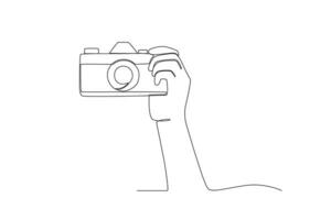 A hand began to photograph the object vector