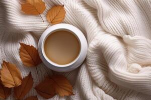 Cup of fresh hot tea with milk with autumn leaves and plaid, top view flat lay, AI Generated photo