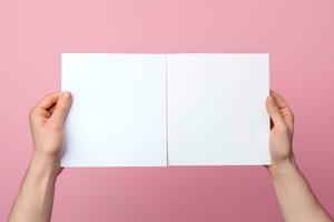 A human hand holding a blank sheet of white paper or card isolated on pink background. ai generated photo
