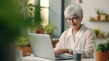 Old woman with laptop photo