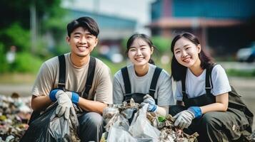 A group of people are using gloves to pick up trash photo