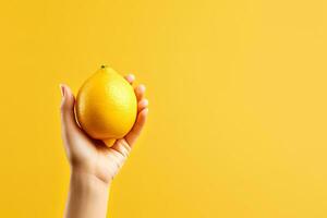 Lemon in hand isolated on yellow background with copy space. ai generated photo