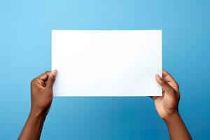 un humano mano participación un blanco sábana de blanco papel o tarjeta aislado en azul antecedentes. ai generado foto