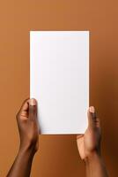 A human hand holding a blank sheet of white paper or card isolated on brown background. ai generated photo