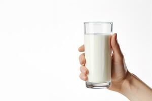 Hand holding a glass of fresh milk isolated on grey background with copy space. ai generated photo