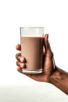 Hand holding a glass of delicious chocolate milk isolated on white background. ai generated photo