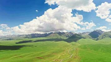 Vast grasslands and mountains in a fine day. video