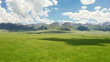 Vast grasslands and mountains in a fine day. video