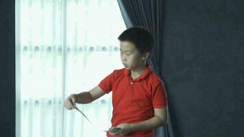 Young Boy flinging money, slow motion shot video