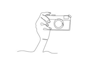 A hand presses the camera button vector