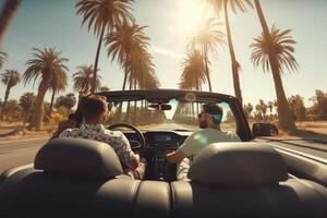 Two friends in car driving on road, having road trip, palm trees around. photo