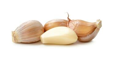 Fresh garlic cloves in stack isolated on white background with clipping path photo