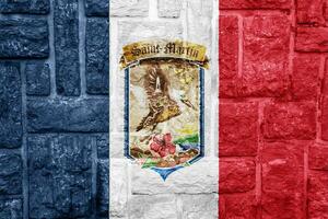 Flag and coat of arms of Collectivity of Saint Martin on a textured background. Concept collage. photo