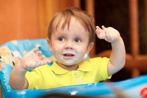 Happy little boy with face got dirty photo