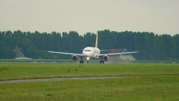 AMSTERDAM, THE NETHERLANDS JULY 24, 2017 - Airbus A320, G EZUL of easyJet acceleration before takeoff at Amsterdam Airport. Side view of jet departure. Tourism and travel concept video