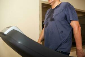 Intensive workout on treadmill, cardio training photo