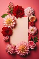 Top view of pink dahlia and red fuchsia flowers in envelope with paper card note on pink background photo