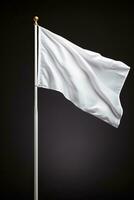 Closeup of a white flag waving on a flagpole against a gray background isolated photo