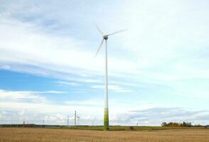 Wind turbine with motion blured blades. photo