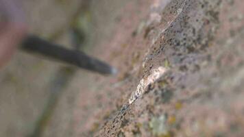 Ancient Man Cave Painting and Writing Historic Inscription Graffiti on Rock Surface With Iron Chisel video