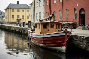 A boat is docked in front of building photo