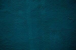 Rough textured painted blue wall background photo