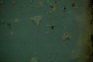 Dingy green wall background texture with damp photo