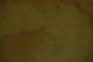 Weathered stained ochre wall background texture photo