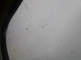 Car window with rain streaks photo