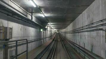 Subway rails in tunnel photo