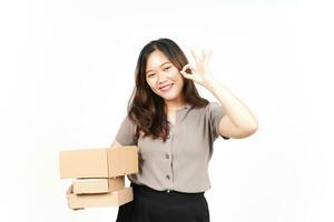 Holding Package Box or Cardboard Box Of Beautiful Asian Woman Isolated On White Background photo