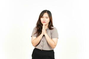 Folding arms and Begging Gesture Of Beautiful Asian Woman Isolated On White Background photo