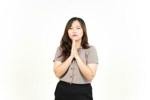 Folding arms and Begging Gesture Of Beautiful Asian Woman Isolated On White Background photo